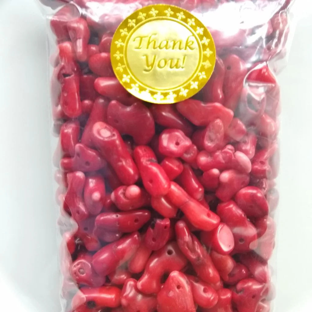 clear plastic bag filled with natural red coral beads  with Thank You sticker on top