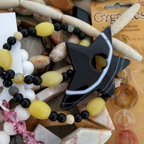 semi-precious stones on a strand with black star shaped stone