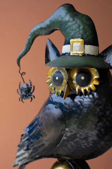 close up of halloween owl and its hat and spider