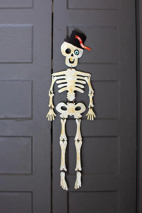 smiling metal skeleton to hang on your door or wall