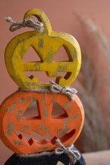 close up of yellow and orange jack-o-lanterns - halloween decor