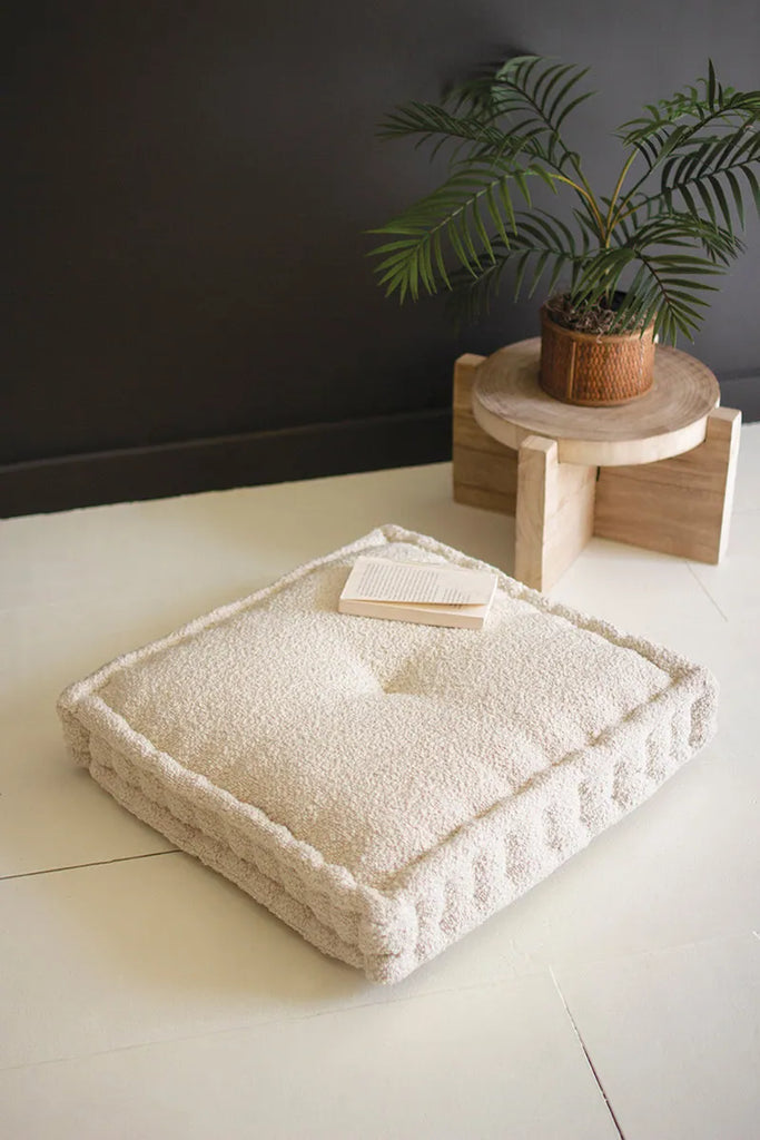 plush square boucle floor cushion - from a top down angled view