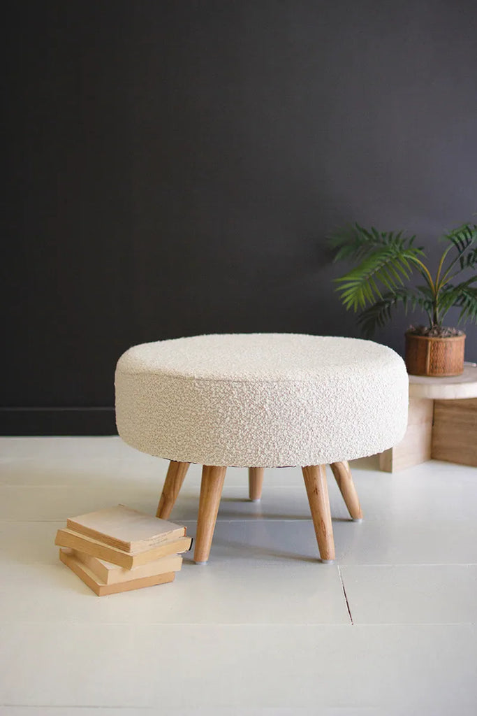 white boucle foot stool with five wood legs