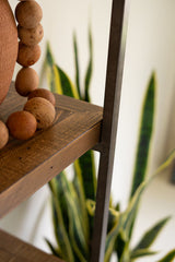 Close-up of pine wood shelf corner when it meets the frame for support