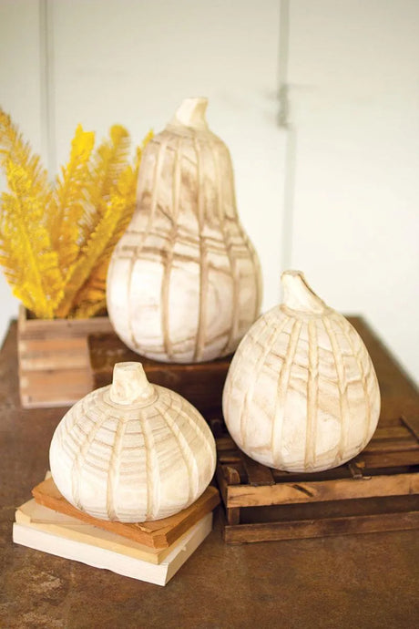 set of three light colored wood pumpkins