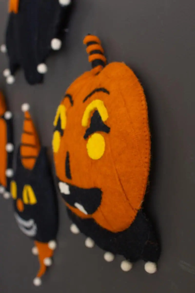 another angled shot of pumpkin wall hanging showing parts of the others