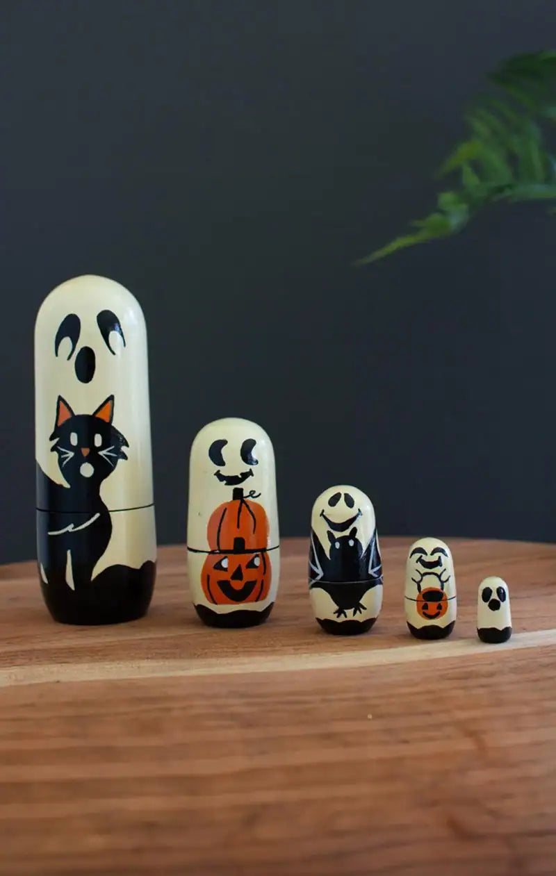 showing all ghost halloween dolls from largest to smallest left to right