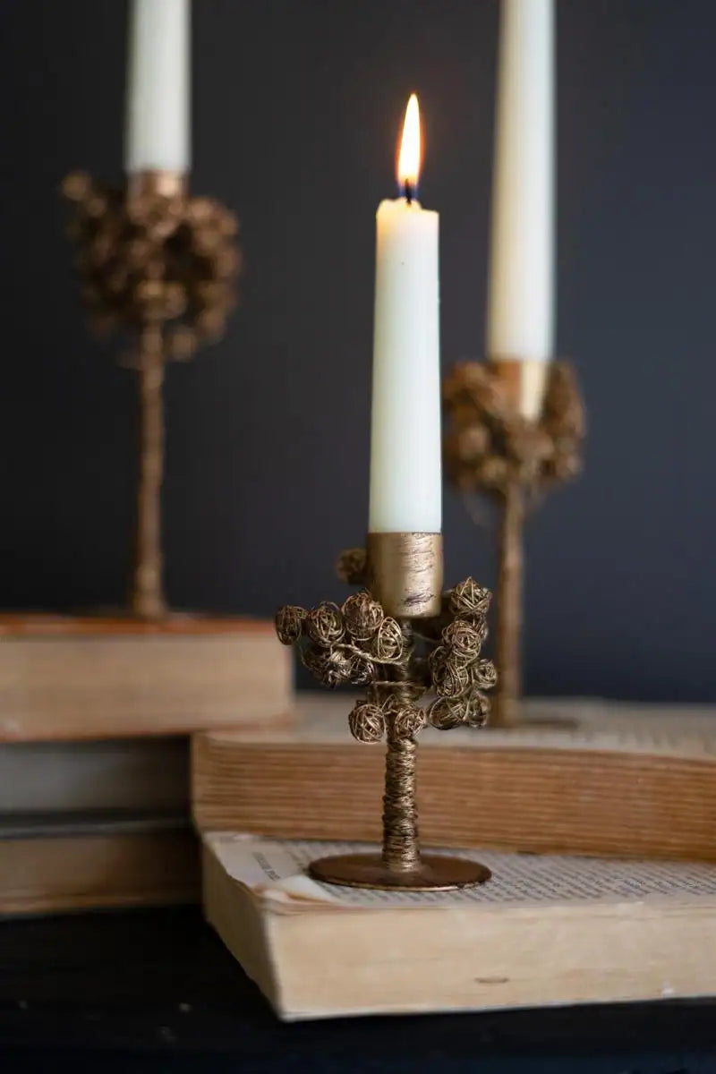 close up of the shortest of candle holders with lit candle