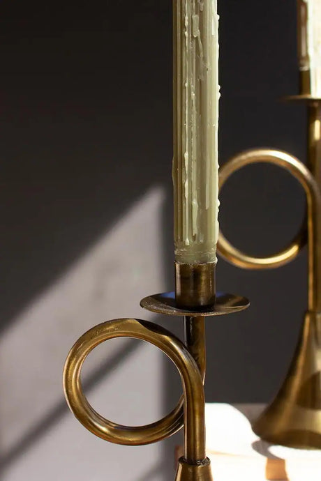 close up of circular trumpet shape of the candle holder