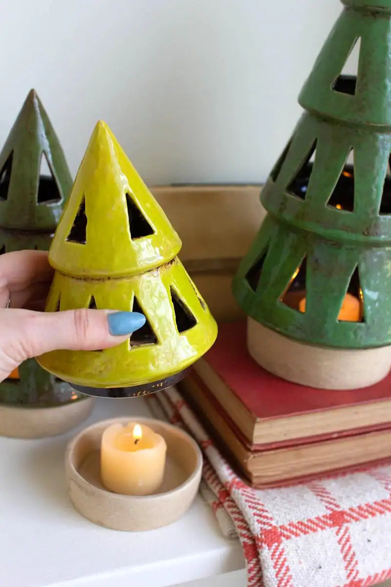 showing ceramic tray that holds tea light after lantern is picked up