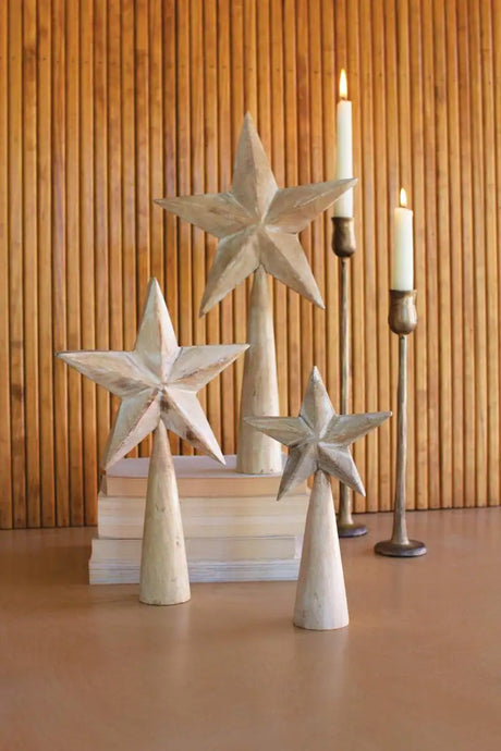 3 white washed wood stars on conical wood stands