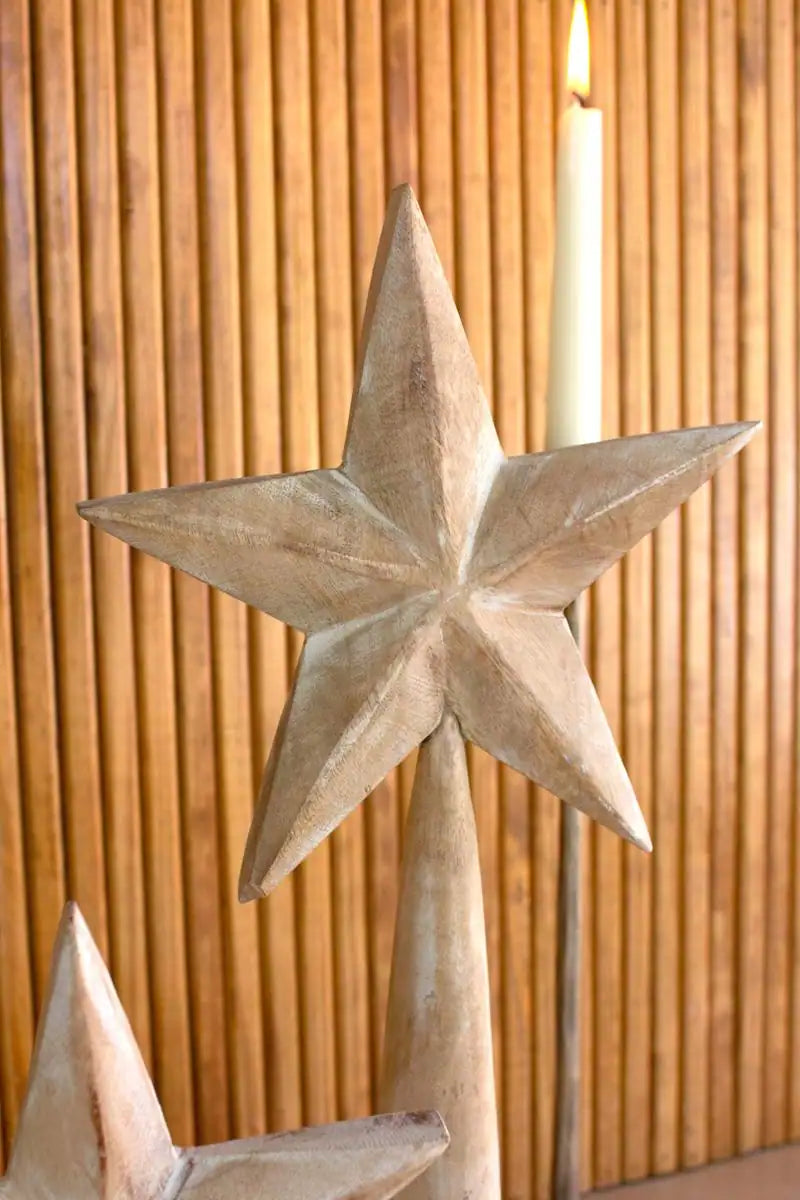 close up of wood star on conical stand