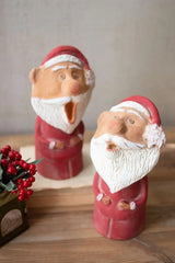 2 clay santa singing passionately