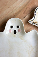 close up of ghost face with O facial expression and rosy cheeks