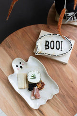 showing white ceramic ghost platter with some finger foods for example and BOO! chat bubble shaped platter next to it