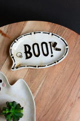 close up of BOO! ceramic platter showing a ring and earrings as example