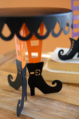 close up of witch's colored legs and boots