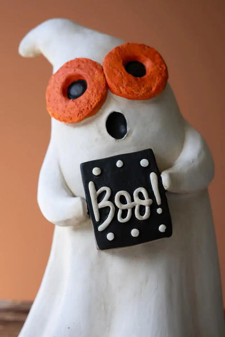 close up of ghost with orange glasses and boo message