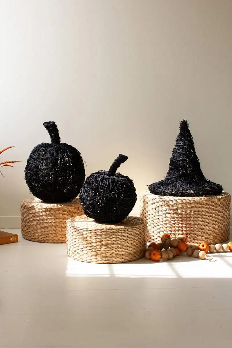 two black twig pumpkins along with a black twig witch's hat - the latter sold separately