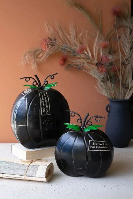 set of 2 black iron pumpkins with green leaves on top - halloween decor