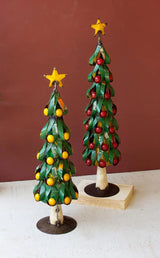 2 recycled green metal christmas trees - one with yellow one with red fruit - each with yellow star on top