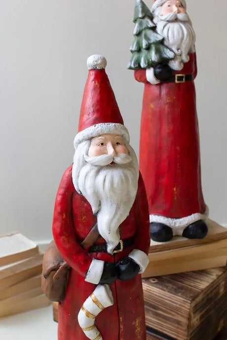 close up of one of the santas with red hat and long white beard