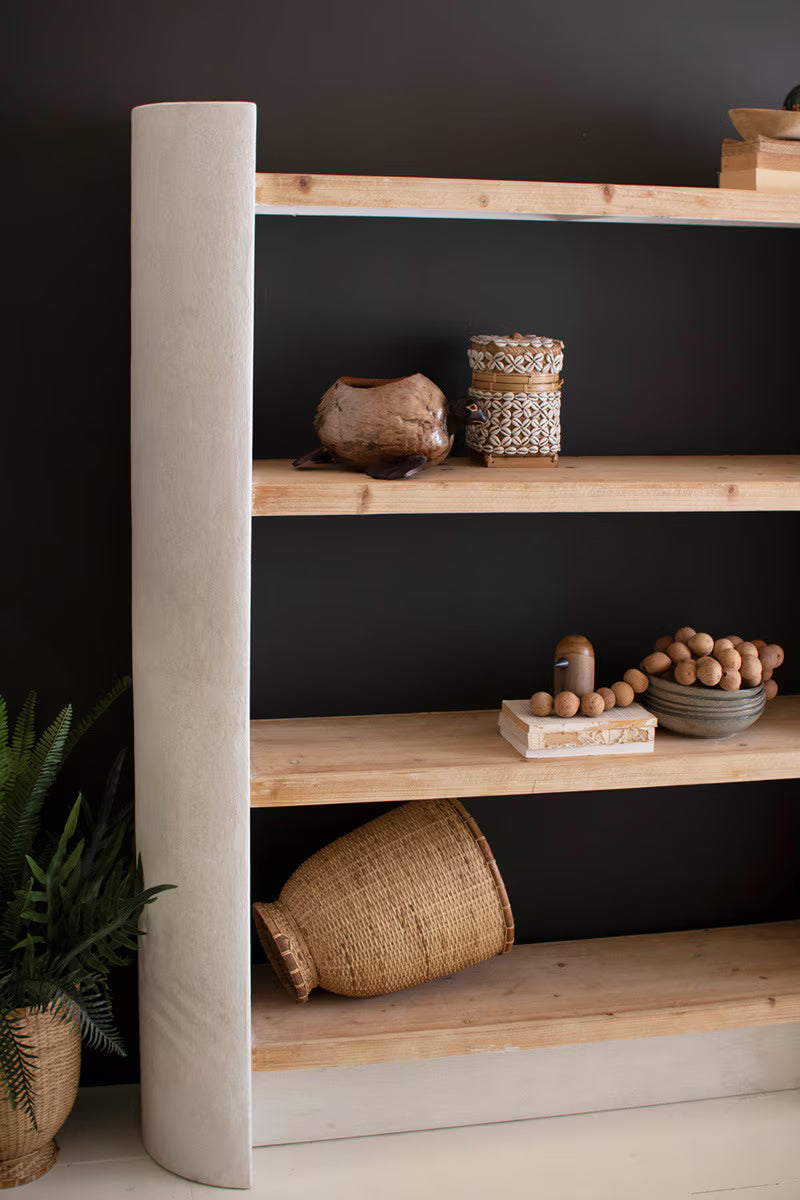 Wooden shelf with decorative items against a dark wall - slight close-up of left side