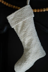 white boucle fabric christmas stocking hanging