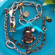 handmade mixed-metal necklace with hand carved happy buddha