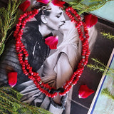 double strand coral necklace with lava heart on a waxed cord with Sterling silver Balinese beads