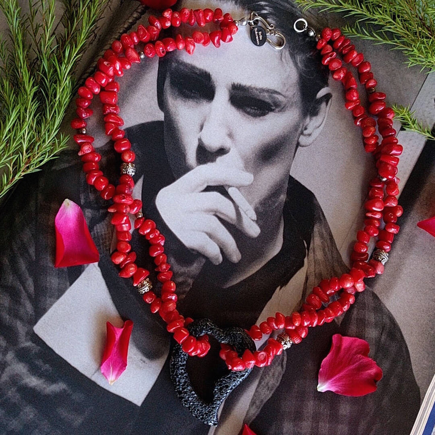 double strand coral necklace with lava heart on a waxed cord with Sterling silver Balinese beads