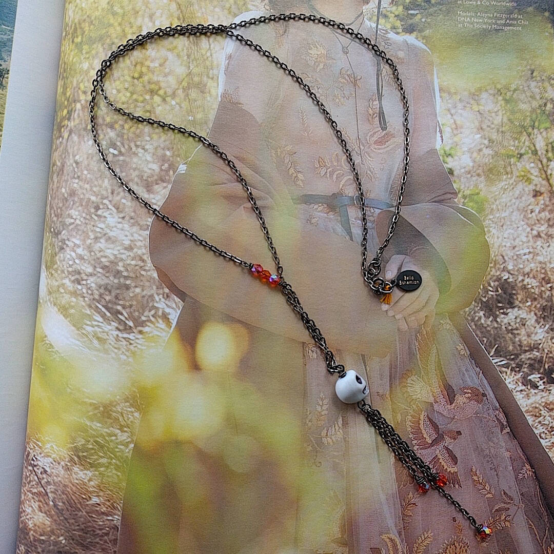 long bohemian gunmetal wire necklace with small skull pendant