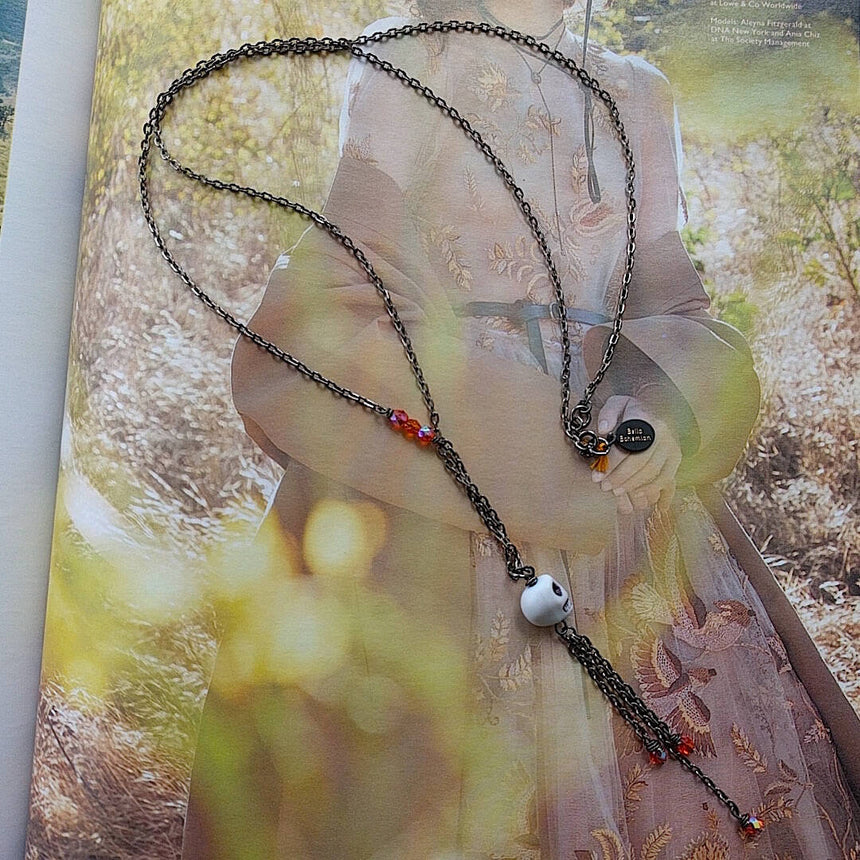long bohemian gunmetal wire necklace with small skull pendant