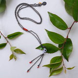 long bohemian gunmetal wire necklace with small skull pendant