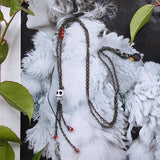 long bohemian gunmetal wire necklace with small skull pendant