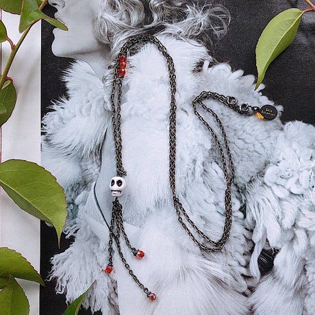 long bohemian gunmetal wire necklace with small skull pendant