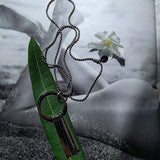 long ball chain necklace with circle tassel pendant