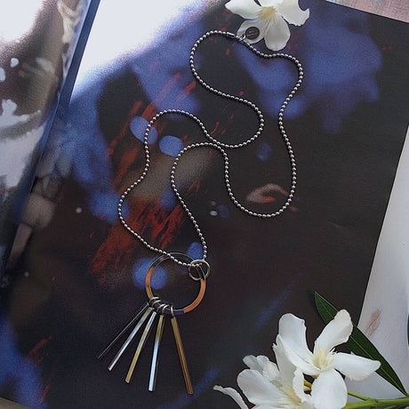 long ball chain necklace with circle tassel pendant