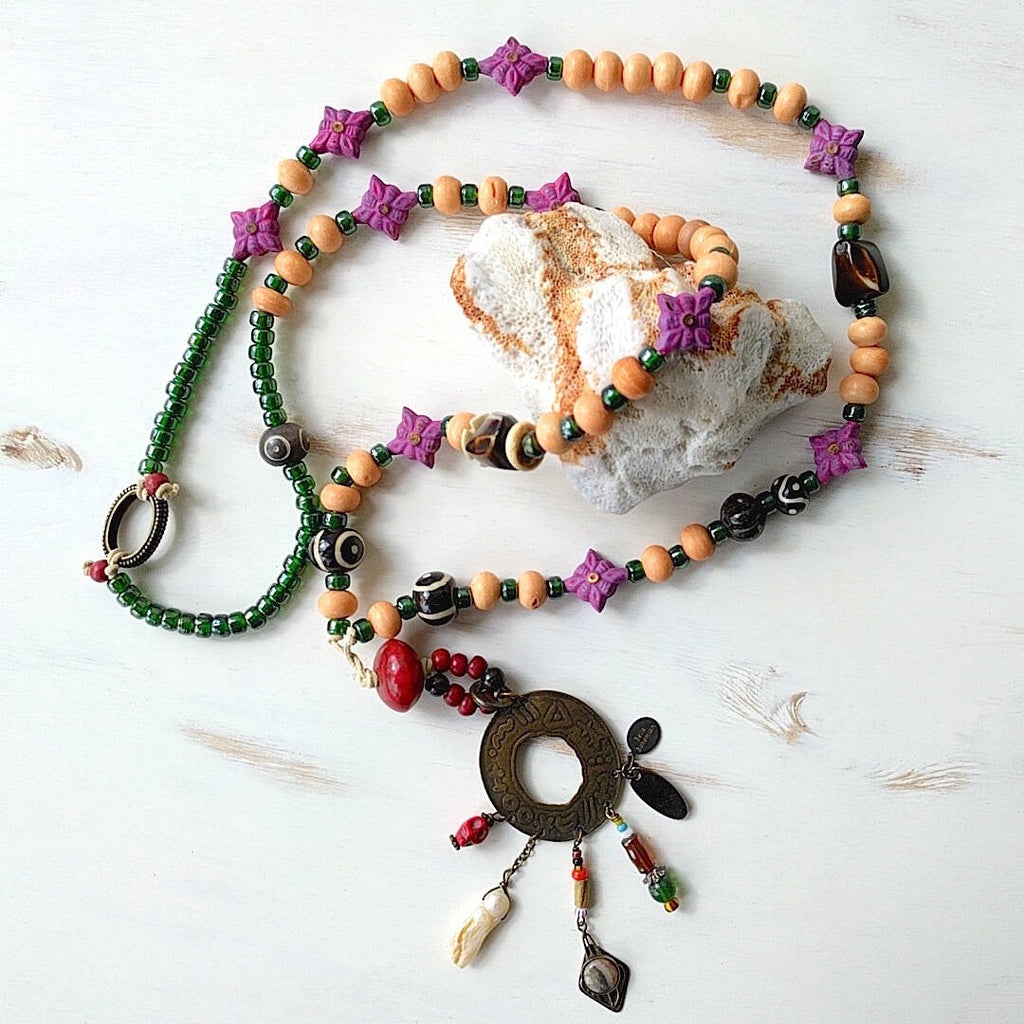 long statement necklace with tibetan and african trade beads - plain background