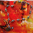 African and Tibetan beads necklace with carved donut shaped bones