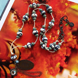 African and Tibetan beads necklace with carved donut shaped bones