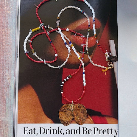 long handmade beaded necklace with a cotton cord colorful Indonesian and Ghana seed glass beads