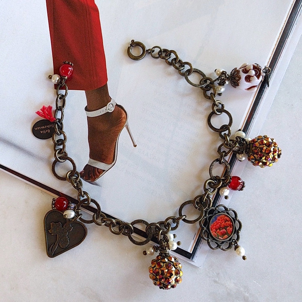 bracelet with charms including brass heart, red round glass, flower frame with red tulips image, round colorful balls and happy white buddha