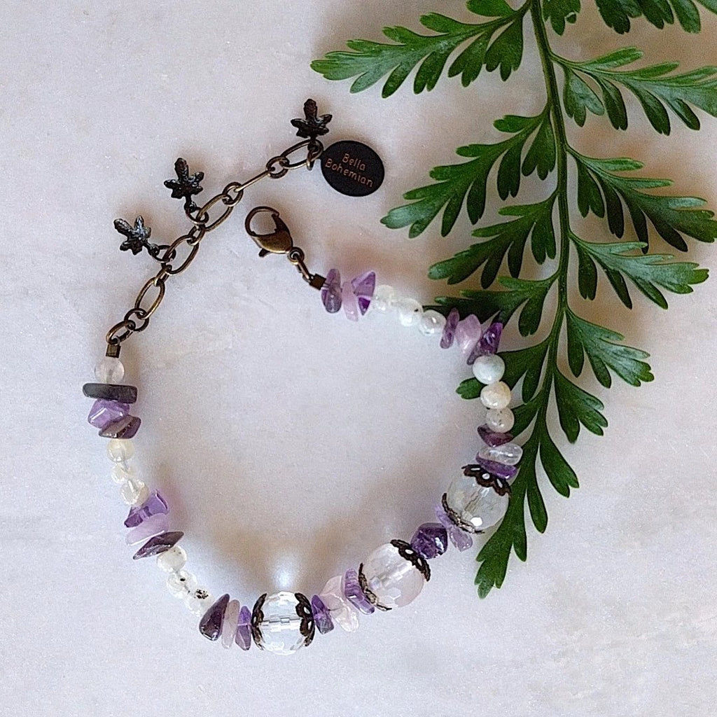 handmade bracelet using small irregular amethyst chips with translucent accent beads, medium round faceted glass beads and fancy brass caps