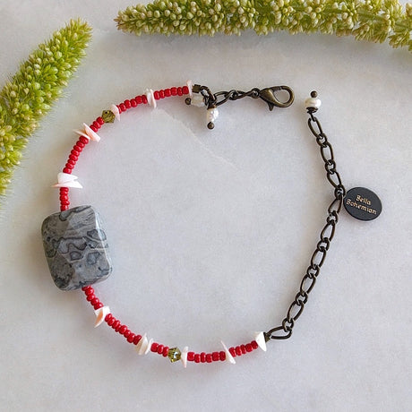 handmade friendship bracelet with red Indian seed beads, white coral chips, tiny green Swarovski beads
