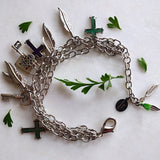 triple chained silver-plated bracelet with various charms