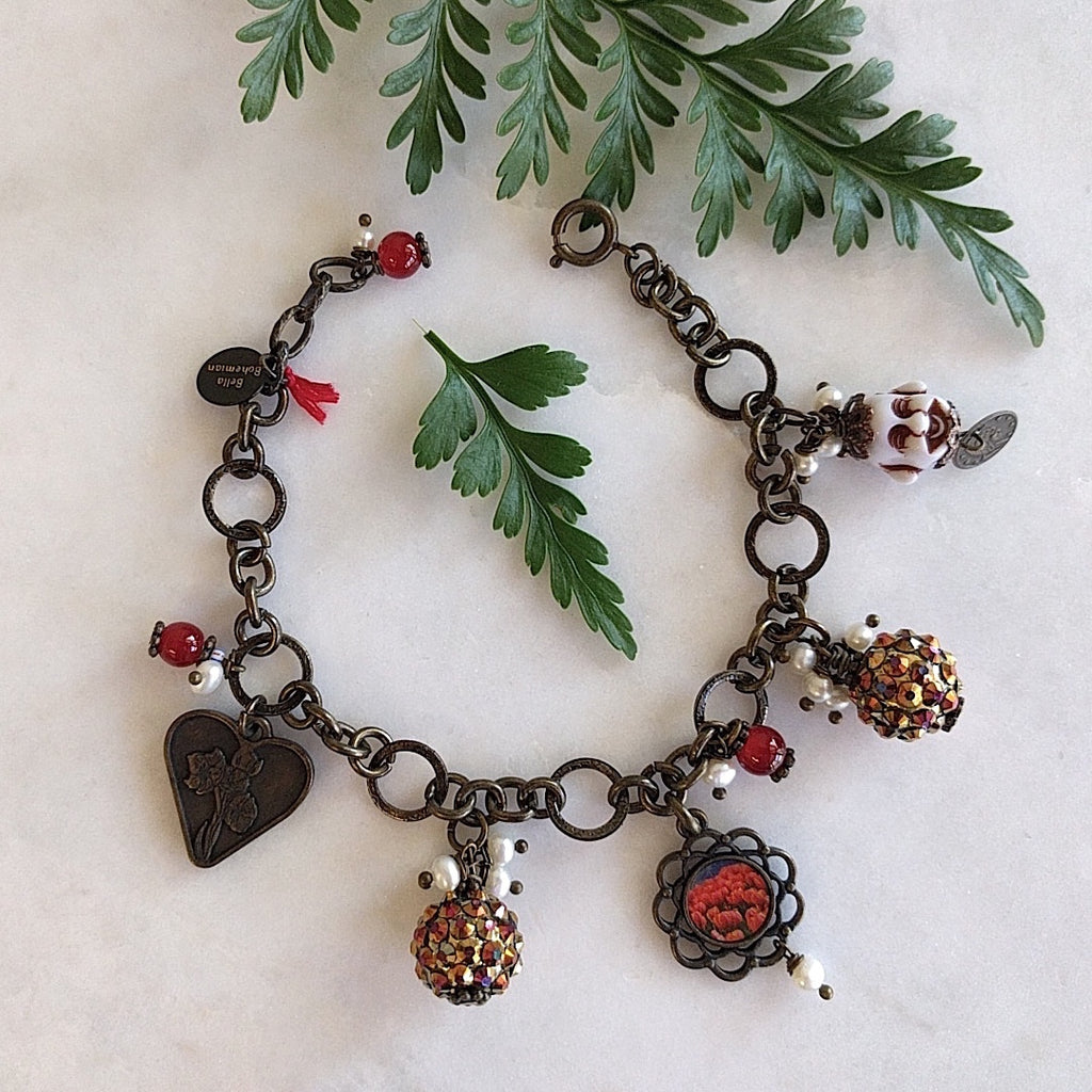bracelet with charms including brass heart, red round glass, flower frame with red tulips image, round colorful balls and happy white buddha with mini coin