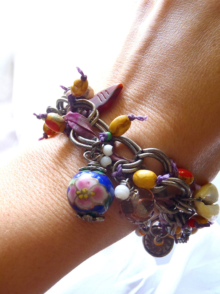 handmade bracelet with dyed dark and light purple sari silk seen on a lady's wrist