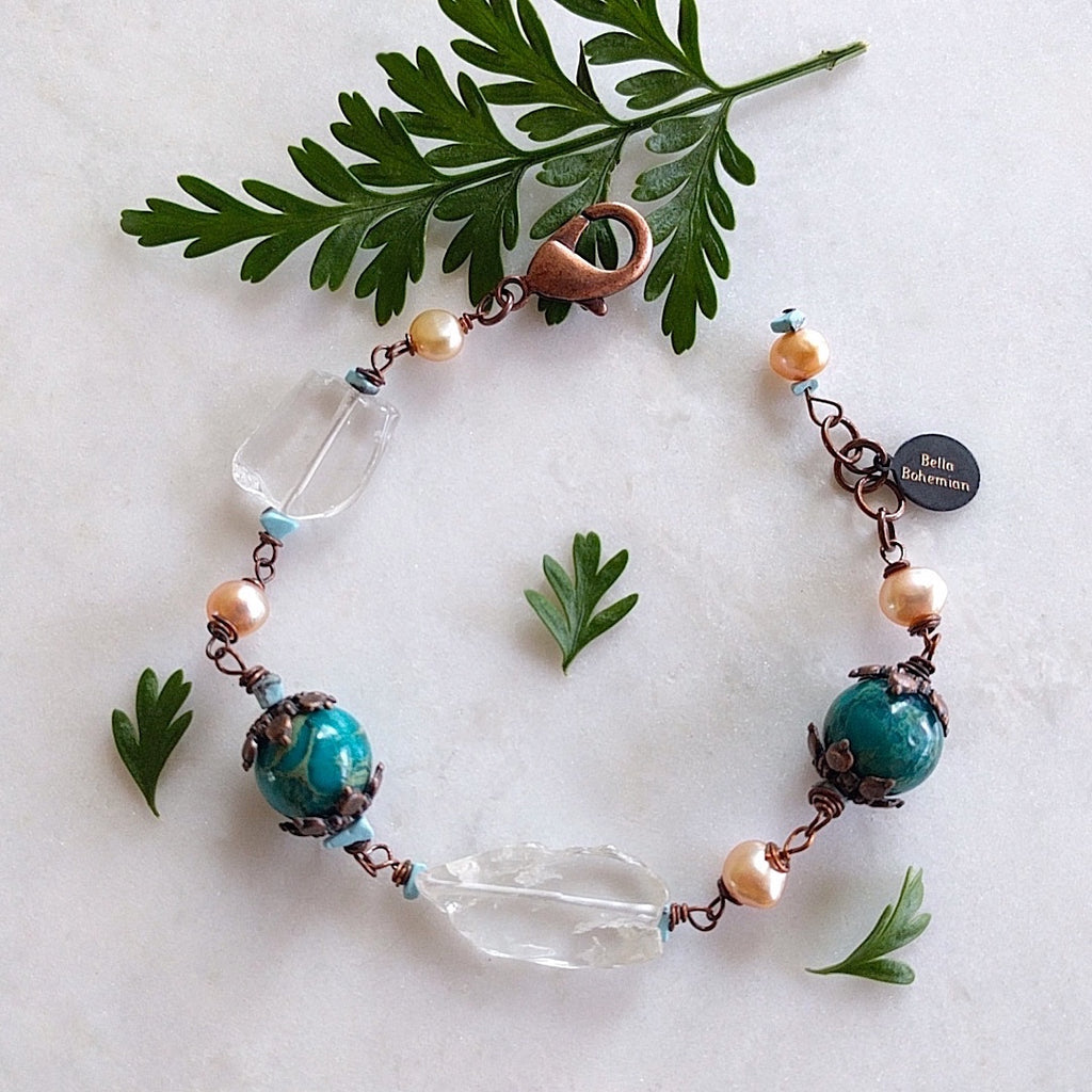 bracelet with creme color fresh water pearls, irregular glass beads, dyed serpentine jasper aqua round beads, copper caps and turquoise chips