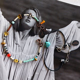 set of bracelets, one with black cotton thread, the other with multicolored seed and glass beads on alternate background